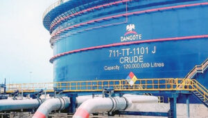 Dangote Refinery facility with fuel storage tanks as petrol prices drop in response to global oil market changes.