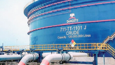 Dangote Refinery facility with fuel storage tanks as petrol prices drop in response to global oil market changes.