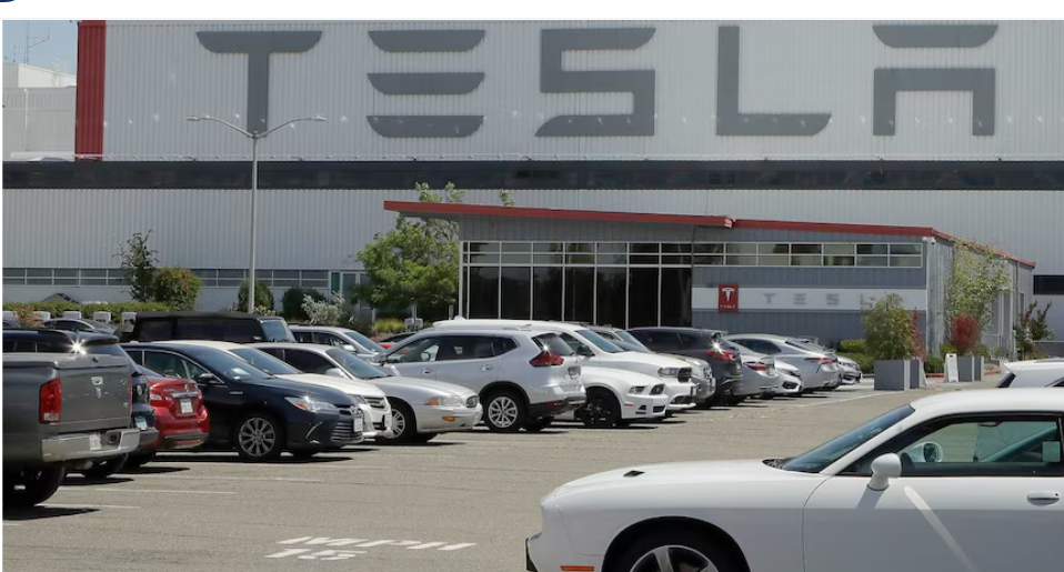 Tesla axes car models, pivots to robots