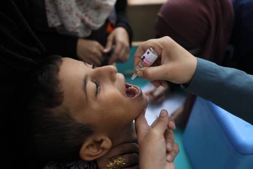 A Gaza child taking polio vaccine