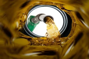 Nigerians queue at a fuel station amid rising prices and proposed 5% fuel tax.