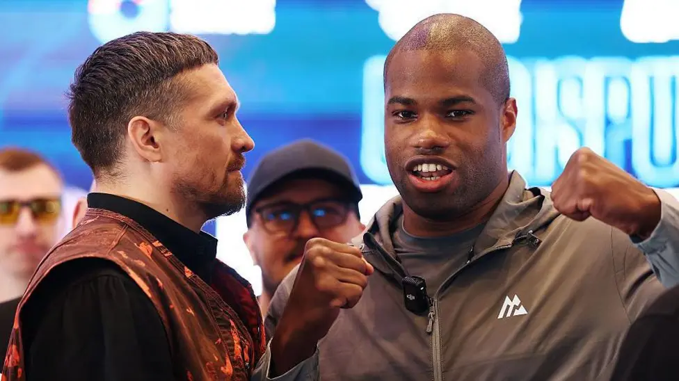 Usyk and Dubois clash over 2023 low blow controversy ahead of July rematch. Dubois' team calls Usyk a "conman"; Usyk fires back with photos.