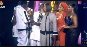 Mohbad's wife, and son receiving his posthumous award at the 17th Headies 