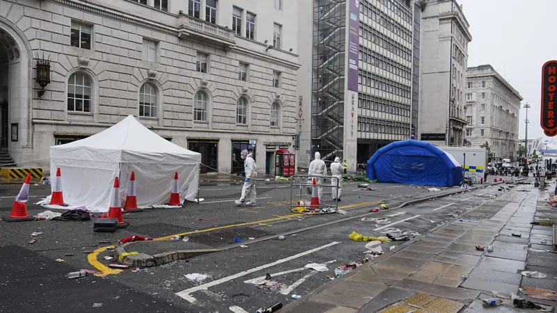 Police given more time to question suspect after car hit 79 fans at Liverpool's title parade.