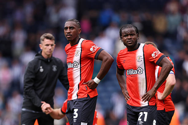 Luton relegated to League One after 5-3 loss to West Brom, ending a late survival push. Alli's brace not enough as defensive woes prove costly.