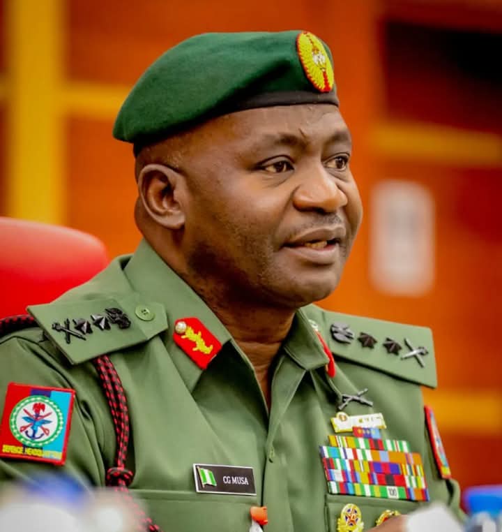 Nigeria’s Defence Minister Christopher Musa praises troops for helping foil a coup attempt in Benin during a ceremony for newly promoted Army officers.