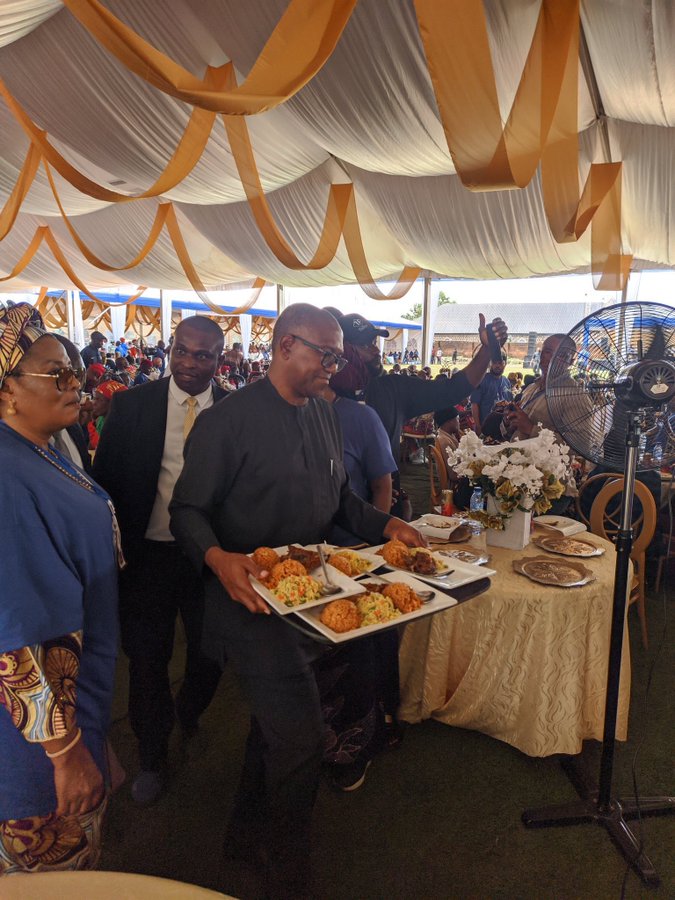 Peter Obi serving food at an event