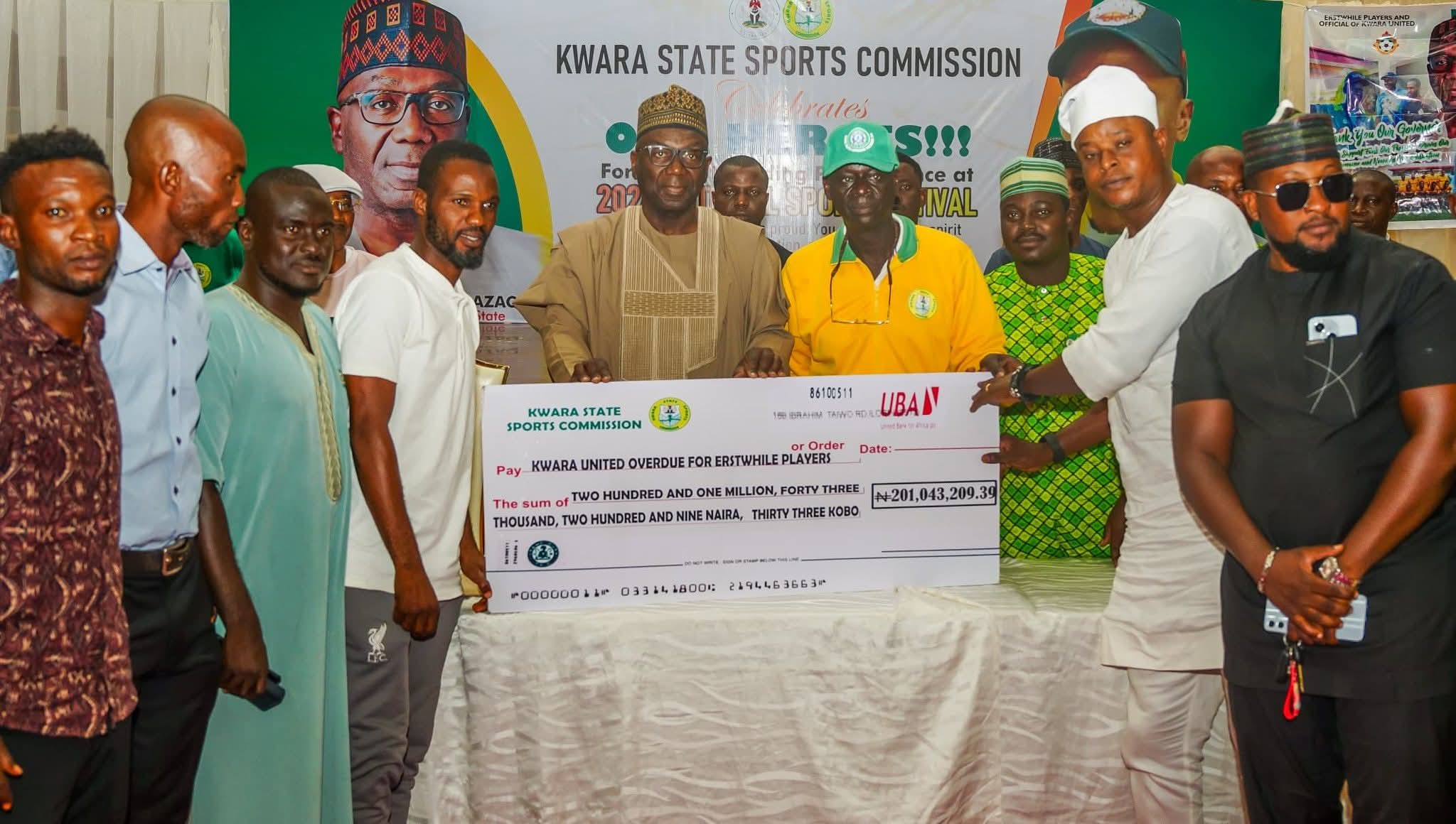 Governor AbdulRahman AbdulRazaq rewarding athletes who participated in the 2024 National Sports Festival in Abeokuta, Ogun State