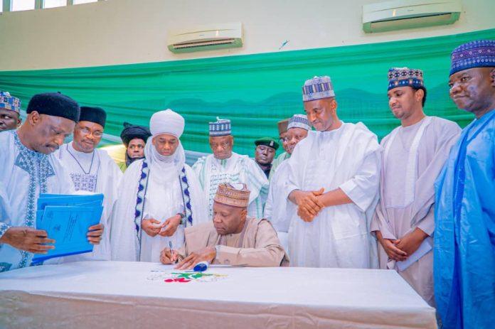 Muhammadu Yahaya signing into law the bil that establish new LCDAs