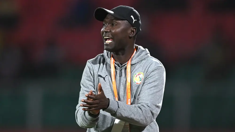 Senegal coach Diallo credits teamwork and tactics for 1-0 CHAN 2024 win over Nigeria, praising midfield control and wing play after Gomis' late goal.