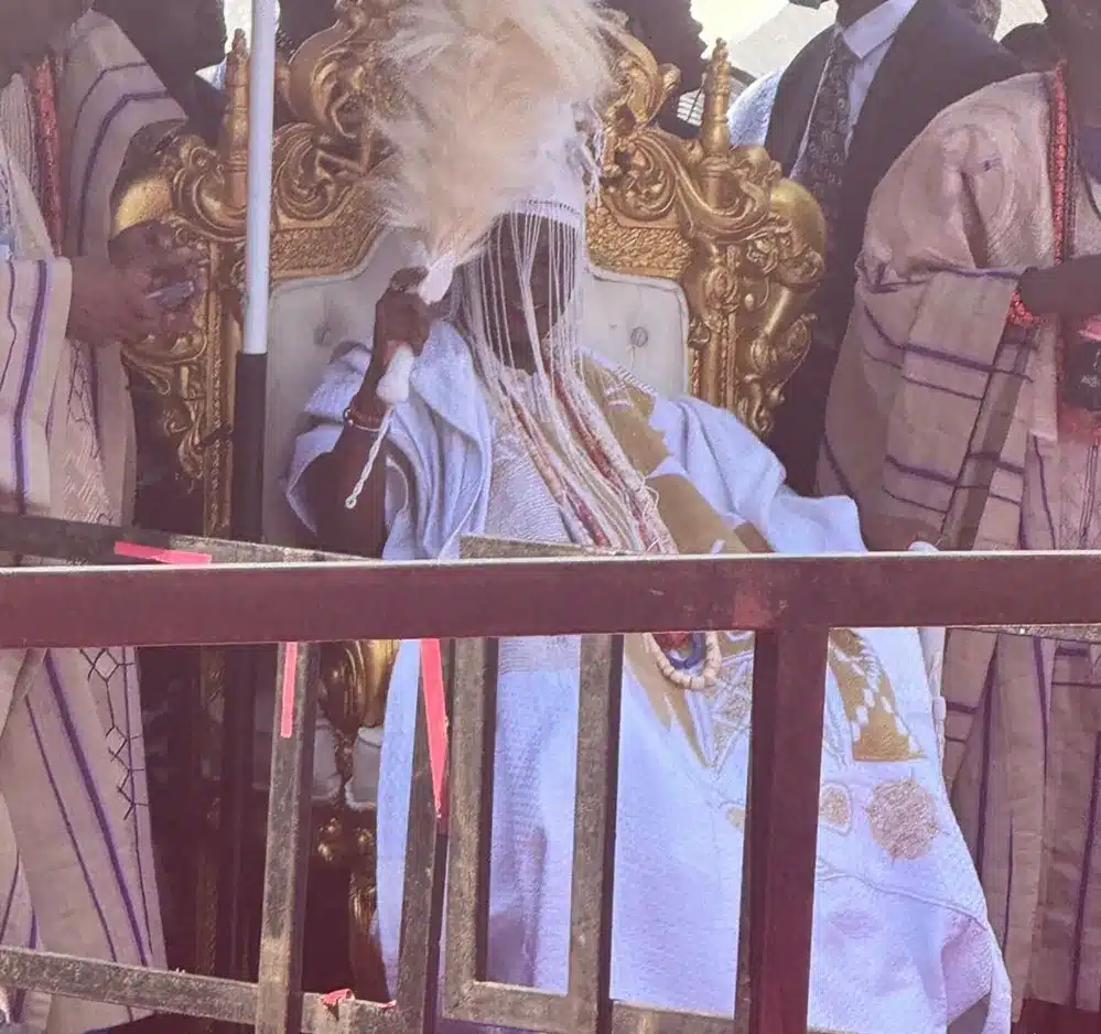 Governor Seyi Makinde presents the staff of office to former Oyo State governor Rashidi Ladoja as he is installed the 44th Olubadan of Ibadan at Mapo Hall, witnessed by President Bola Tinubu and dignitaries.