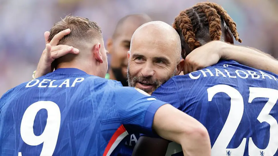 Liam Delap returns from injury as Chelsea seek to fix goal woes, with Maresca hoping the striker ends their attacking struggles and number nine “curse.”