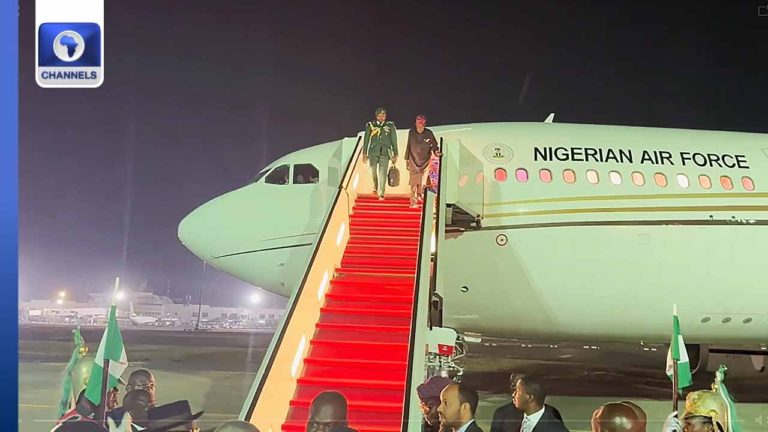 President Bola Tinubu disembarks from the presidential jet.