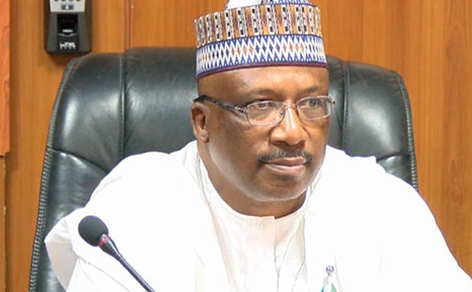 Lt. Gen. Abdulrahman Dambazau speaks at an event in Abuja, warning that the US may be seeking to establish a military base in Nigeria amid claims of religious persecution.