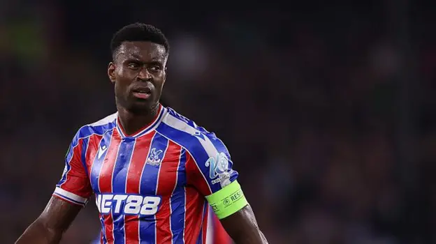 Marc Guehi has withdrawn from the England squad with a foot injury and returns to Crystal Palace for rehab, missing the final World Cup qualifier in Albania.