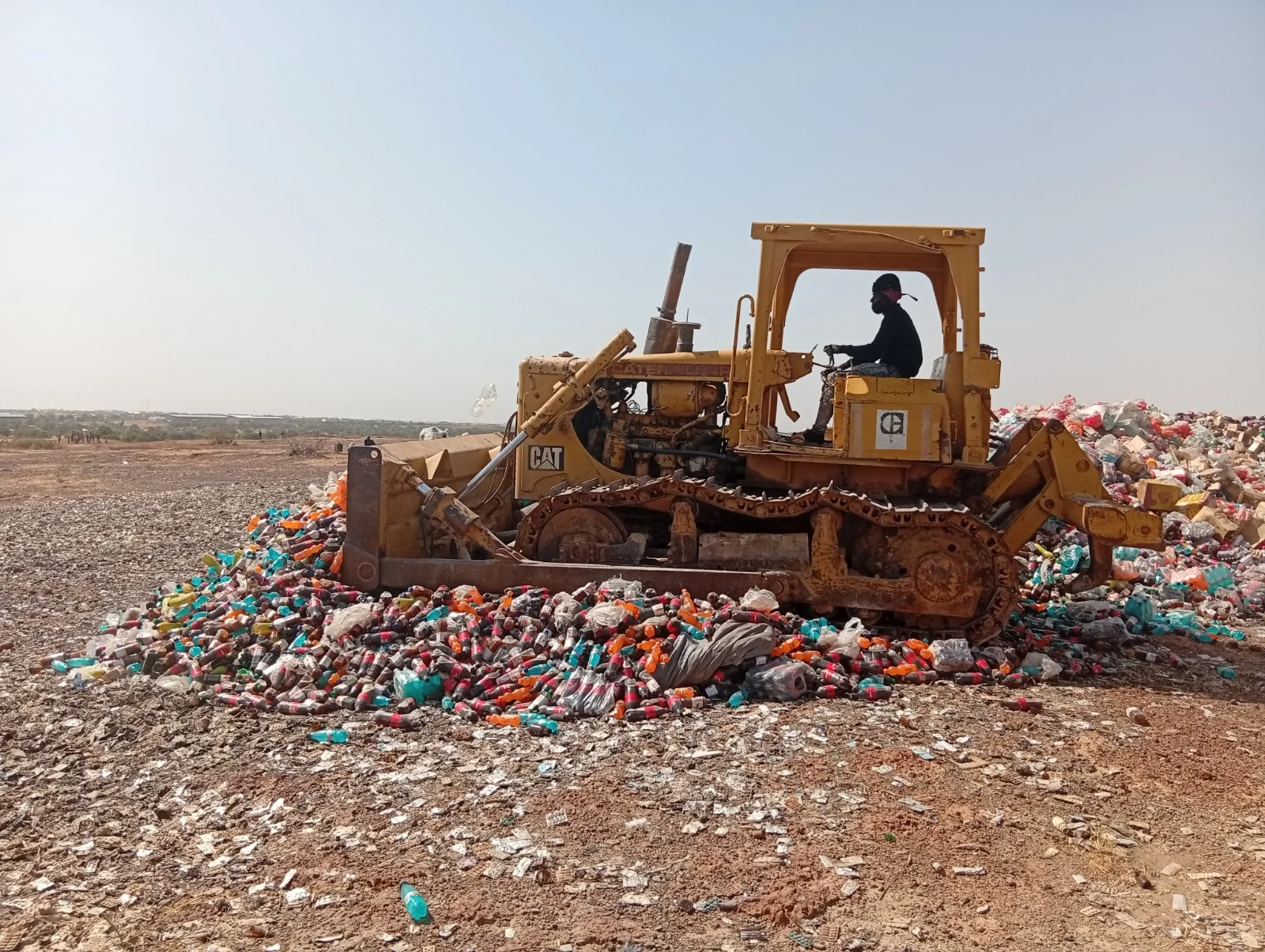 NAFDAC officials overseeing the destruction of counterfeit and expired medicines and products at the Kalibawa site in Kano.