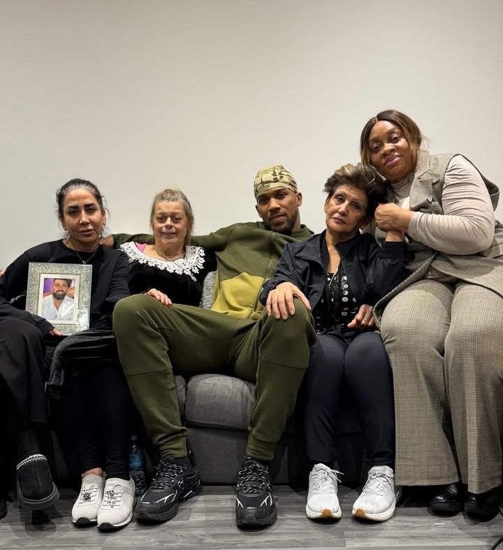 Anthony Joshua with the families of his late friends