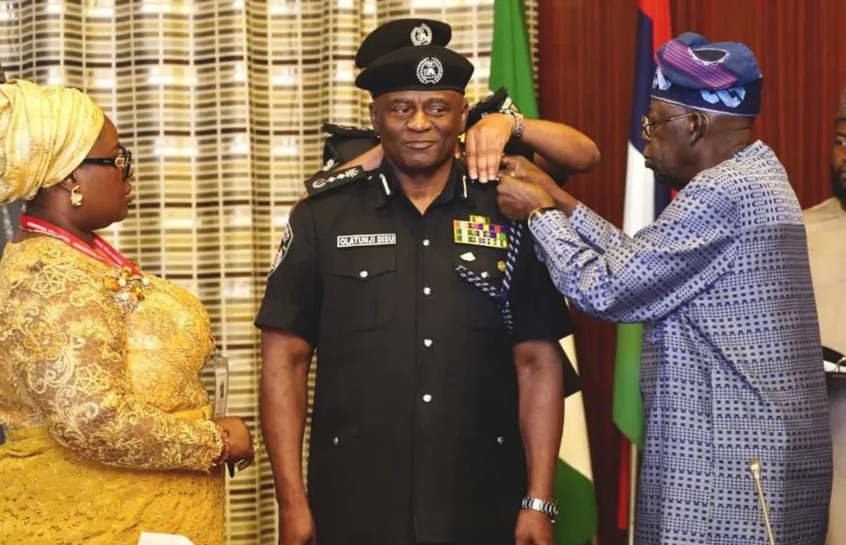 President Bola Tinubu swearing in Olatunji Disu as Inspector-General of Police at the Council Chambers, State House, Abuja.